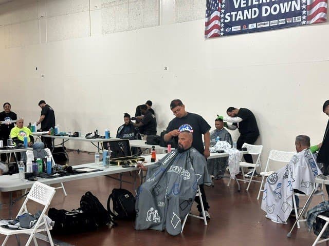 Volunteer giving a haircut at a Stand Down event