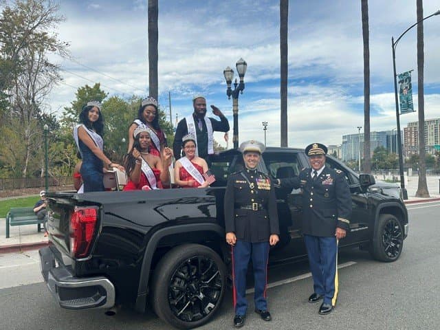 Grand marshal with HBCU float in the parade